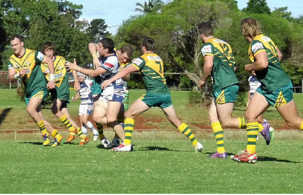 TEAMWORK: Wattles Tim Hentschel and Matt Duggan (7) halt a Brothers runner in last week’s Round 6 Toowoomba Rugby League fixture at Glenholme Park.